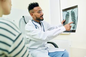 Doctor going over X-Ray with patient